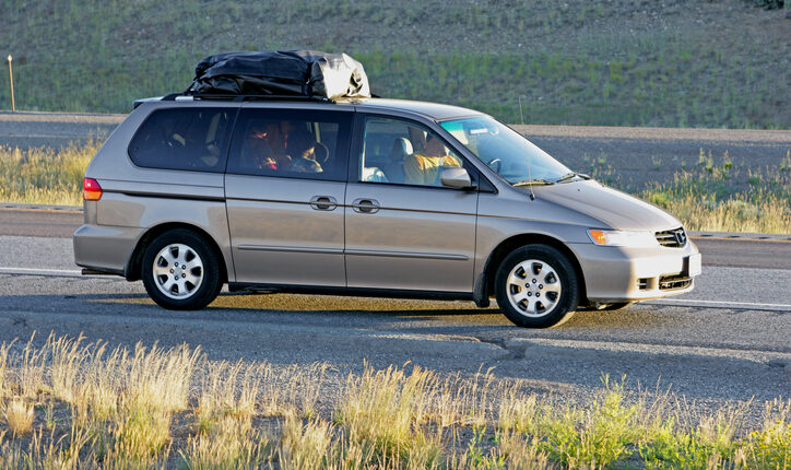 Family vacation in a gray minivan